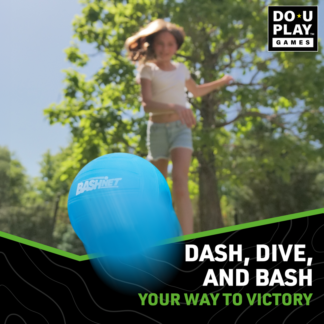 Blue BashNet ball flying toward camera with girl running and green trees in bright outdoor setting