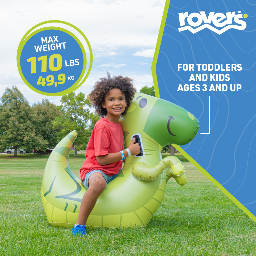 Child sitting on a green inflatable dragon toy with Rovers branding and product details.