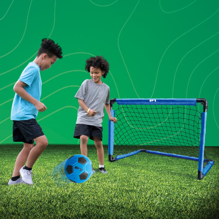 Two children playing with a P1 soccer ball and training goal 